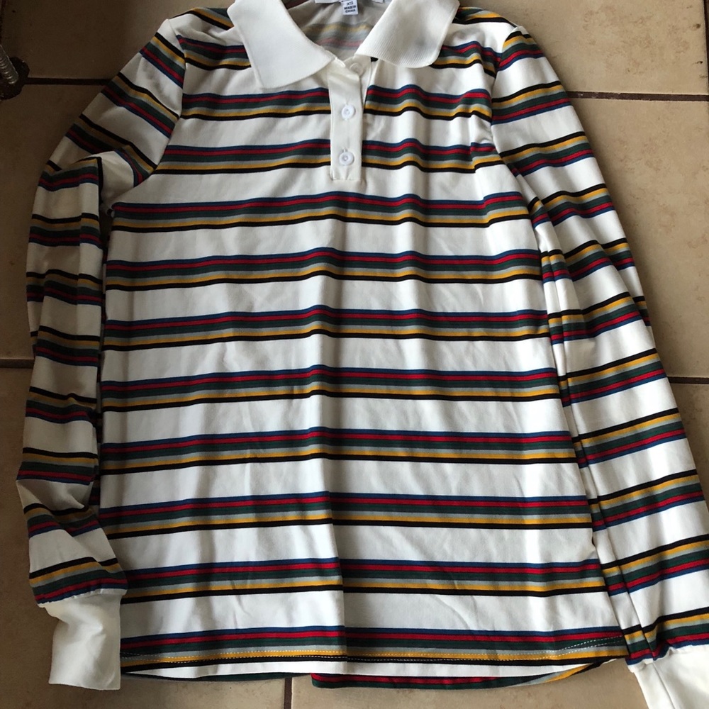 A long sleeve collared shirt with colored stripes